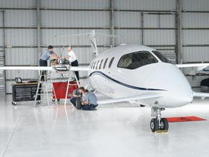 Readers in Action Winner: The Banyan Air Service technicians include (standing left to right) Johnny Gomez, Paul Baran, (kneeling behind wheel) Hartley Starratt, and (in front of wheel) Alex Sandrin. The photographer was Jerry Wyszatycki