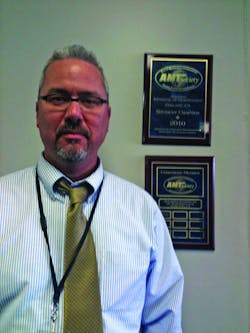 Joshua Smith, executive director, Aviation Institute of Maintenance Oakland Campus, receives a plaque for becoming an AMTSociety corporate member, the 10th AIM campus to do so. Joshua Smith, executive director, Aviation Institute of Maintenance Oakland Campus, receives a plaque for becoming an AMTSociety corporate member, the 10th AIM campus to do so.