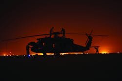 Minnesota National Guard technicians at night accomplishing a PMD check on a Black Hawk in Basra, Iraq. Photo courtesy of Keith Shelstad. Minnesota National Guard technicians at night accomplishing a PMD check on a Black Hawk in Basra, Iraq. Photo courtesy of Keith Shelstad.