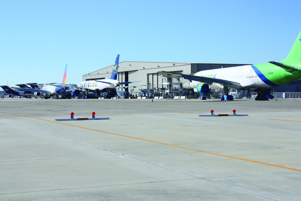 Flightstar (below) operates a major MRO facility at Cecil, and is preparing to move into a new paint facility (inset) that it will utilize in conjunction with the Florida State College at Jacksonville.