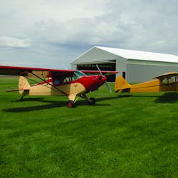 Newly restored PA-12 and J-3 at home at Stanton Airfield.