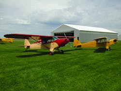 Newly restored PA-12 and J-3 at home at Stanton Airfield. Newly restored PA-12 and J-3 at home at Stanton Airfield.