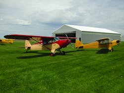 Newly restored PA-12 and J-3 at home at Stanton Airfield.