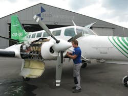 A Star Airservice technician prepares this Cessna 404 for an engine run. A Star Airservice technician prepares this Cessna 404 for an engine run.