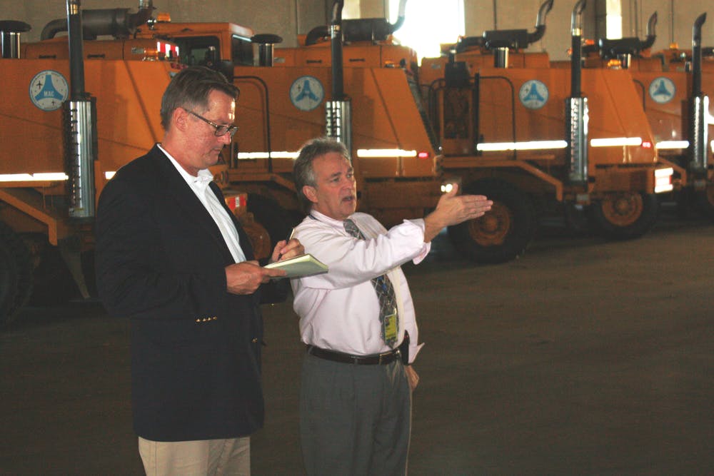 Steve Smith goes over the snow-removal operations with Paul Sichko, assistant airport director, MSP.