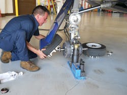 An AMT changing the Goodyear tires on this Lear aircraft. Photo courtesy of Goodyear. An AMT changing the Goodyear tires on this Lear aircraft. Photo courtesy of Goodyear.