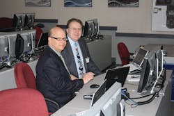 Boeing&apos;s Cammeron Forrest provides Ronald Donner with a lesson in the Boeing 787 learning lab.