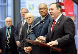U.S. Rep. Mike Pompeo, right, addresses the media during a press conference Monday, Dec. 19, 2011 held at the National Center for Aviation Training in Wichita, Ks.