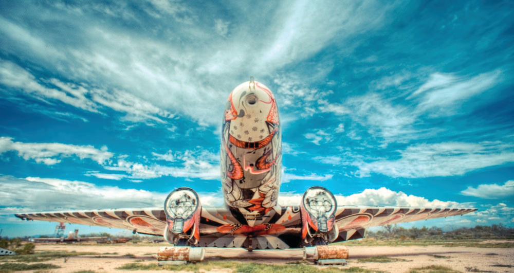 Re-imagined by Brazilian graffiti artist Nunca, an abandoned DC3 comes to life with a striking picture of an eagle leading men through the skies.