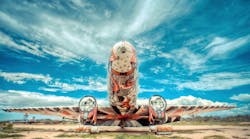 Re-imagined by Brazilian graffiti artist Nunca, an abandoned DC3 comes to life with a striking picture of an eagle leading men through the skies.