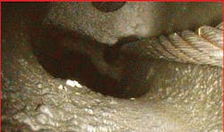 Miss-routed cable inside in the center of the column assembly. Control movement caused it to cut into the magnesium casting. Miss-routed cable inside in the center of the column assembly. Control movement caused it to cut into the magnesium casting.