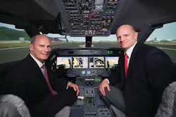 Larry Flynn, President of Gulfstream, and Eric Hinson, Executive Vice President of FlightSafety, in the new Gulfstream G450/G550 simulator located at the Hong Kong Learning Center. Larry Flynn, President of Gulfstream, and Eric Hinson, Executive Vice President of FlightSafety, in the new Gulfstream G450/G550 simulator located at the Hong Kong Learning Center.