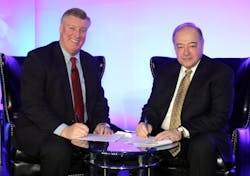 EAA President/CEO Rod Hightower (L) and HAI President Matt Zuccaro sign an agreement that will continue HAI participation at EAA AirVenture Oshkosh in 2012. (HAI photo)