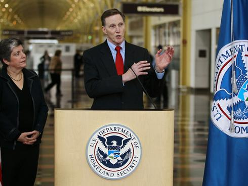 Homeland Security Secretary Janet Napolitano watches as Transportation Security Administration (TSA) Administrator John Pistole announces the expansion of a passenger pre-screening initiative on Feb. 8, 2012, at Washington's Ronald Reagan National Airport.