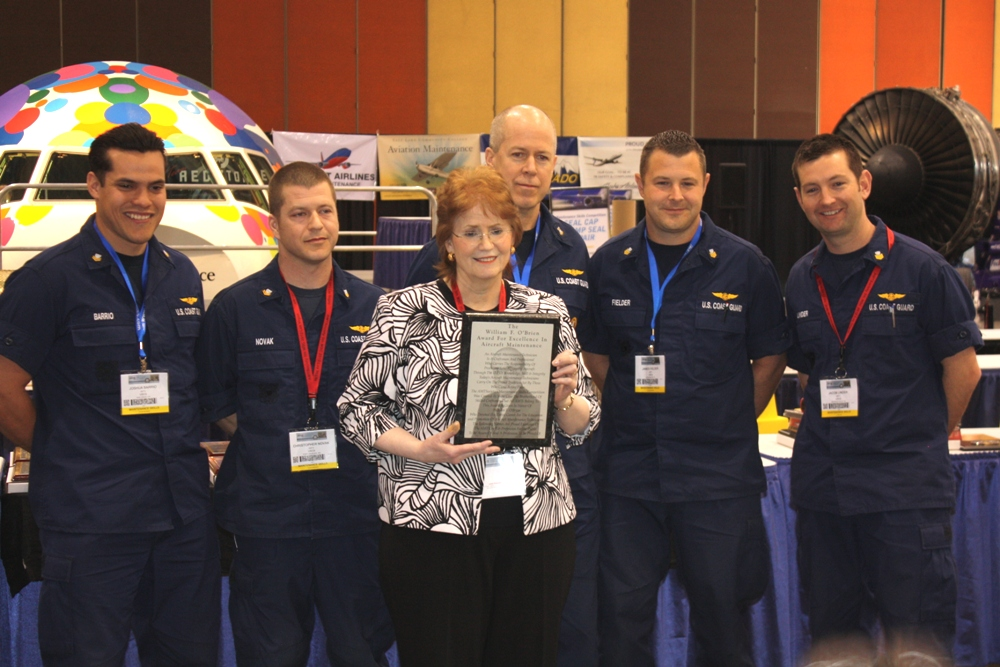 USCG team took the overall fastest score and received the &ldquo;William F. 'Bill' O'Brien Award for Excellence in Aircraft Maintenance Award'. Pictured with them is Marie O'Brien, Bill's wife.