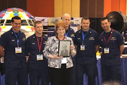 USCG team took the overall fastest score and received the &ldquo;William F. &apos;Bill&apos; O&apos;Brien Award for Excellence in Aircraft Maintenance Award&apos;. Pictured with them is Marie O&apos;Brien, Bill&apos;s wife.