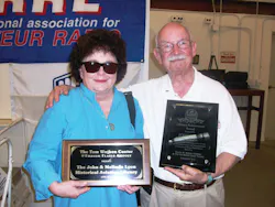 John and Melinda Lyon hold up John Lifetime Achievement Award and the plaque dedicating the Wathen Center’s Library to the Lyons. John and Melinda Lyon hold up John Lifetime Achievement Award and the plaque dedicating the Wathen Center’s Library to the Lyons.