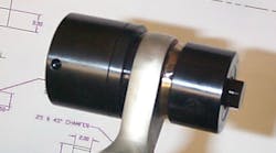 A portable tri-roller tool used to swage a new bearing into an actuator rod-end.