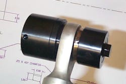 A portable tri-roller tool used to swage a new bearing into an actuator rod-end.
