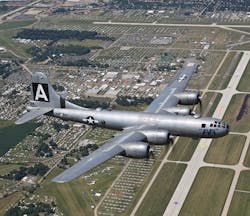 The B-29 bomber FIFI flies over the EAA AirVenture grounds in 2011. (EAA photo by Jim Koepnick.)
