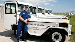 Chief Warrant Officer Greg McDermott stands in front of a new fleet of SATS, a standardized tow tractor developed originally for the United States Army. Chief Warrant Officer Greg McDermott stands in front of a new fleet of SATS, a standardized tow tractor developed originally for the United States Army.