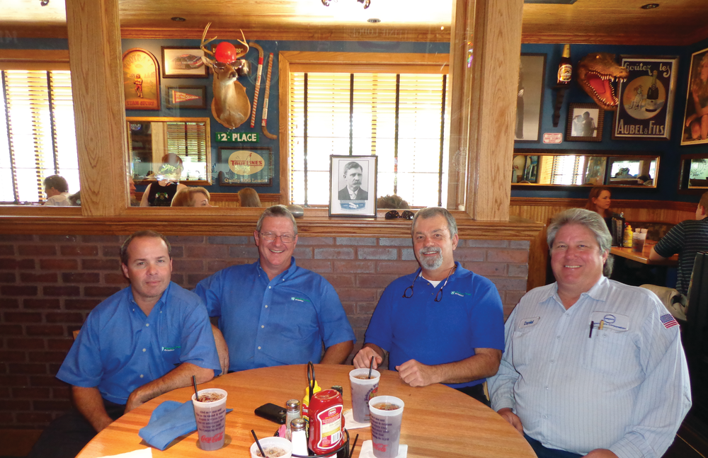 From left to right is Robbie Moseley, Bob Kilbourne, Gary Hamilton, from Emerald Coast Aviation, and Daniel Crawley from Segers Aero Corp. celebrating Charles E. Taylor and AMT Day.