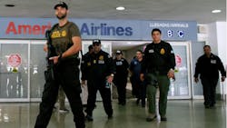 U.S. federal agents raided Puerto Rico&apos;s international airport and other areas early on June 6, 2012, arresting at least 33 people suspected of smuggling millions of dollars&apos; worth of drugs aboard commercial flights.
