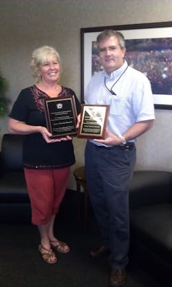 Janese Thatcher receives the 2012 Minnesota and 2012 Great Lakes Region aviation maintenance awards from Jim Niehoff Minnesota FAASTeam Manager.
