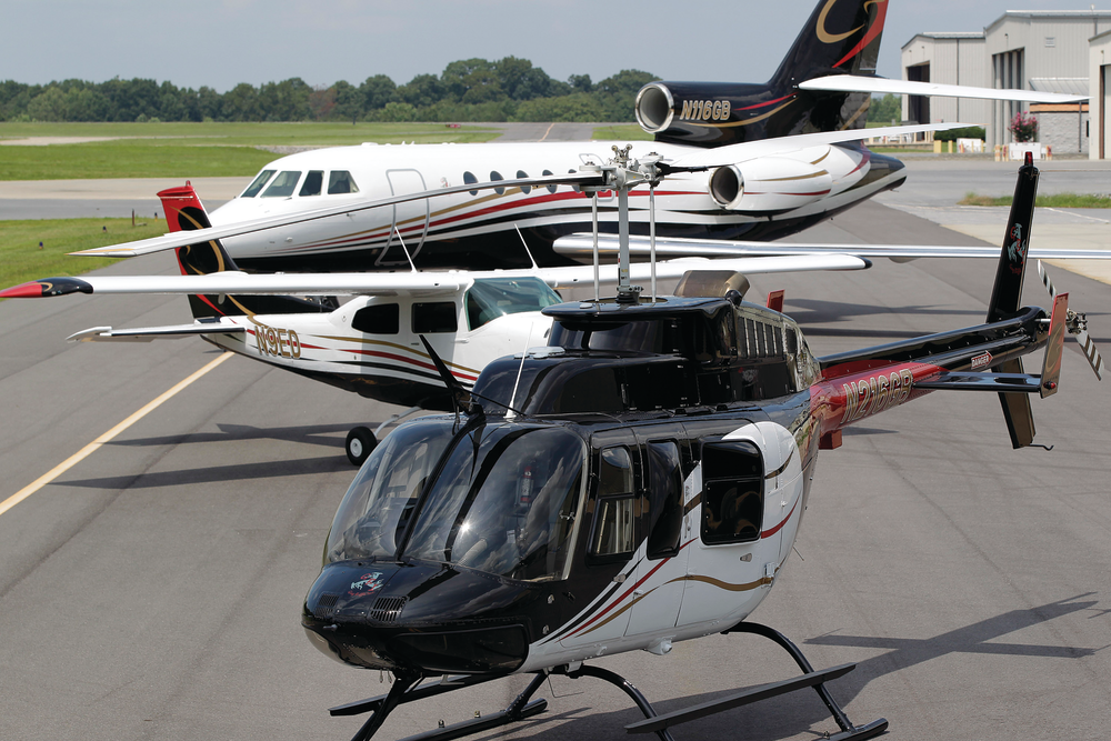 Many aircraft owners use the same basic design for all their aircraft, as is the case with this Bell 206, Cessna 210, and Falcon 50.