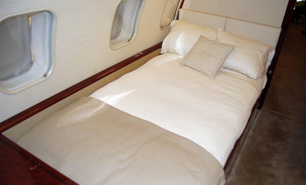 The modification of the aft cabin enabled the installation of a permanent custom-made bed in the aft cabin which is located opposite two new single seats and next to a customized side-ledge.