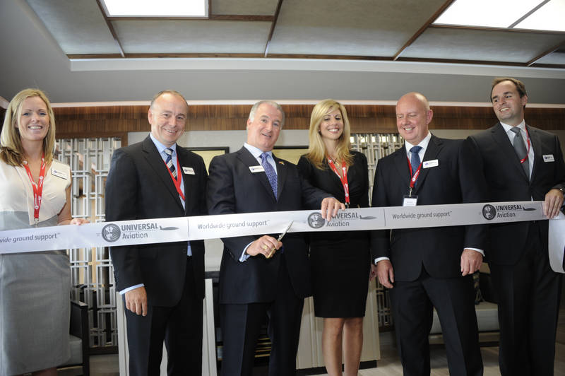 Universal Weather and Aviation, Inc. Chairman of the Board Greg Evans officially cuts the ribbon at the inauguration celebration of the completely refurbished FBO at Universal Aviation Stansted. Evans said the renovation of Universal Aviation Stansted is just the latest in the company's ongoing commitment to Europe and ultimately improving client experiences.