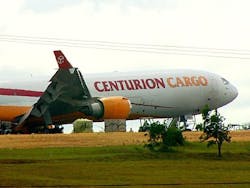 A cargo plane with a blown tire forced the cancellation of 450 flights and overloaded the already saturated capacity of other air terminals.