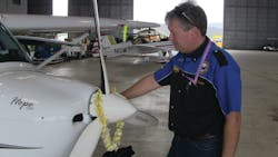 Michael Combs shares an emotional moment with his REMOS aircraft named Hope One as he quietly reflects on the completion of his epic 40,000 mile, 50 state journey. Michael Combs shares an emotional moment with his REMOS aircraft named Hope One as he quietly reflects on the completion of his epic 40,000 mile, 50 state journey.