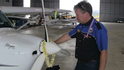 Michael Combs shares an emotional moment with his REMOS aircraft named Hope One as he quietly reflects on the completion of his epic 40,000 mile, 50 state journey.