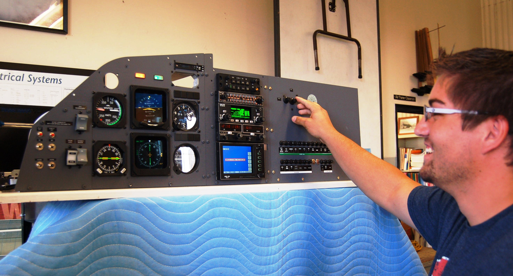A student in Idaho State University&rsquo;s Aircraft Maintenance Program tries out the new cockpit class simulator donated by Western Aircraft.