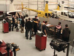 Robinson Helicopter maintenance students in the blade and hub learning area. Robinson Helicopter maintenance students in the blade and hub learning area.