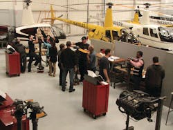 Robinson Helicopter maintenance students in the blade and hub learning area.