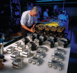 LORD technician checks aircraft engine vibration isolation mounts. LORD technician checks aircraft engine vibration isolation mounts.