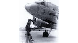 Tony Vasko, a CAP Cadet at age 15, holds a 10-pound CO2 extinguisher to be used, if needed, on the C-47 in the picture. &apos;If I look worried,&apos; he says, &apos;I was.&apos;