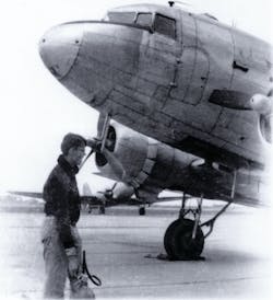 Tony Vasko, a CAP Cadet at age 15, holds a 10-pound CO2 extinguisher to be used, if needed, on the C-47 in the picture. 'If I look worried,' he says, 'I was.' Tony Vasko, a CAP Cadet at age 15, holds a 10-pound CO2 extinguisher to be used, if needed, on the C-47 in the picture. 'If I look worried,' he says, 'I was.'
