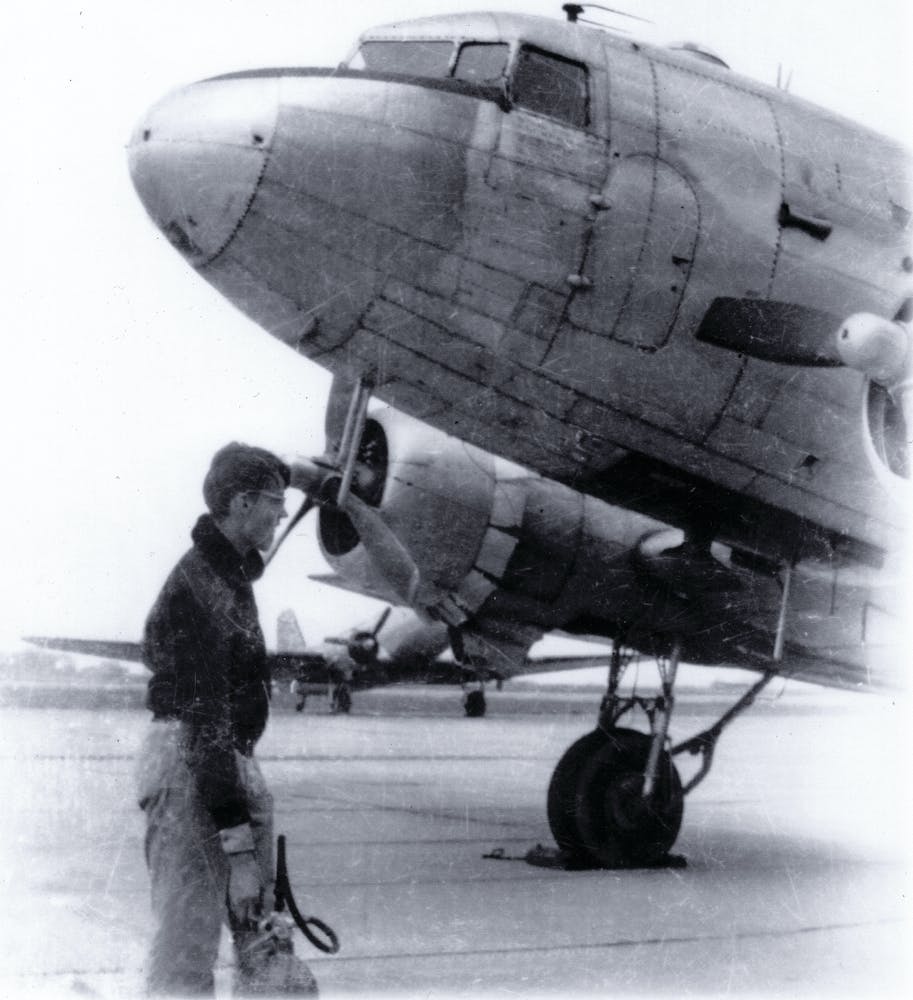 Tony Vasko, a CAP Cadet at age 15, holds a 10-pound CO2 extinguisher to be used, if needed, on the C-47 in the picture. &apos;If I look worried,&apos; he says, &apos;I was.&apos;