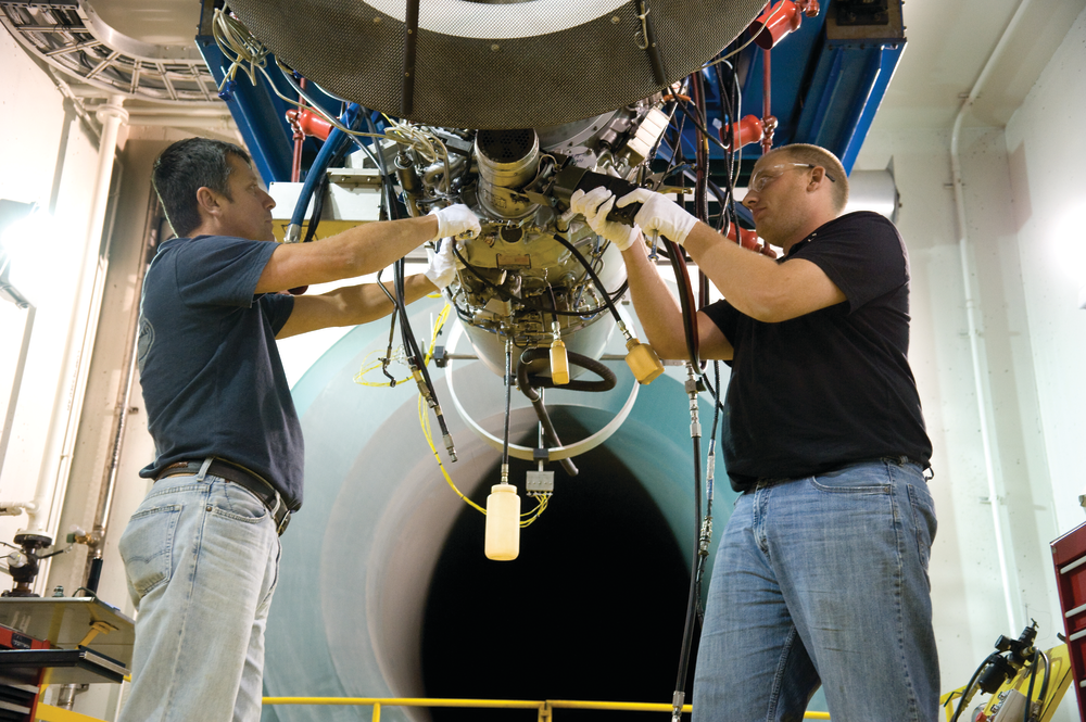 Vector Technicians prepare aircraft engine for test cell.