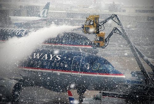 One of the main reasons for the delays, according to the memo, were air traffic controllers not posting a ground stop early enough to stop flights as snow rolled. The other reason: a &apos;communications breakdown&apos; between airport personnel and air traffic control about deicing and snow removal.