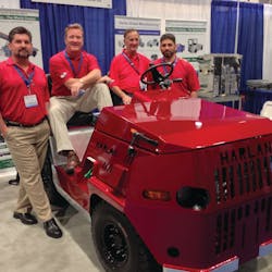 Harlan executives gather around the company&apos;s Trans-Con Model HTSB, unveiled at Harlan&apos;s booth at last week&apos;s AviationPros LIVE trade show in Las Vegas, NV.