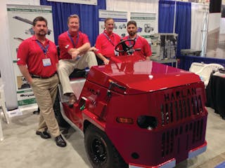 Harlan executives gather around the company&apos;s Trans-Con Model HTSB, unveiled at Harlan&apos;s booth at last week&apos;s AviationPros LIVE trade show in Las Vegas, NV.