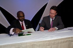 Michael Steen, Chairman of TIACA (right) and Boubacar Djibo, Director, Air Transport Bureau of ICAO at the signing of the Declaration of Intent in Dallas.