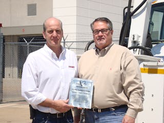 Jerry Derusha, Premier Engineering and Manufacturing alongside Larry Laney, director of ground support for Southwest Airlines.