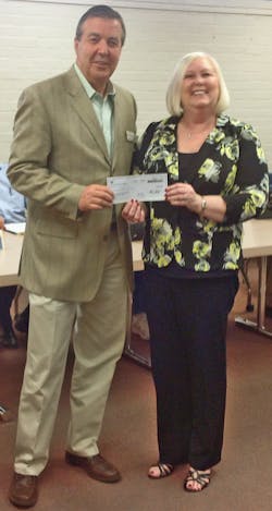 The PPG Industries Foundation has donated $10,000 to the Palmdale School District in California for the Palmdale Aerospace Academy charter school. Here, Deb Noe, HR manager at PPG Industries&rsquo; (NYSE: PPG) aerospace manufacturing facility in nearby Mojave, Calif., presents the check to Palmdale School District Board President James C. Ledford, who is also mayor of the City of Palmdale.