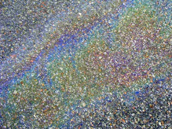 It’s hard to miss the rainbow – sheen from fluid drips and leaks that accumulate on the ground from all the aircraft and various types of GSE that use the airport. Some of these fluids are leaking from the equipment itself and some the result of rushed or sloppy servicing procedures.