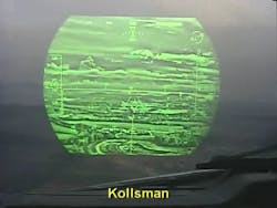 Kollsman EVS II displayed through a HUD. JPG: Kollsman EVS II displayed looking thru a Head Up Display (HUD) on approach to an airport with the fog seen in the aircraft windshield around the HUD.